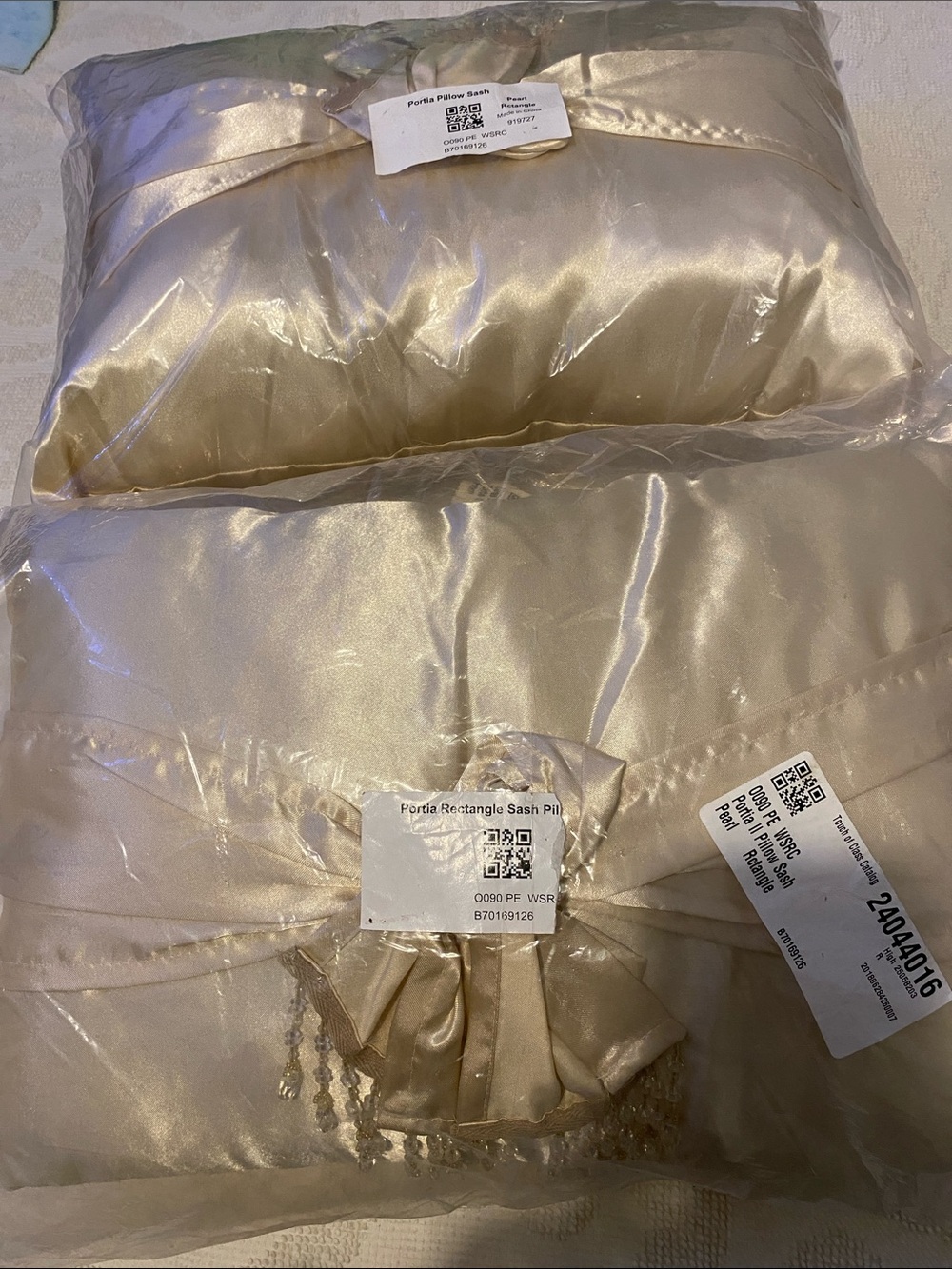 Satin Sash Accent Pillow in Champagne, includes two pillows